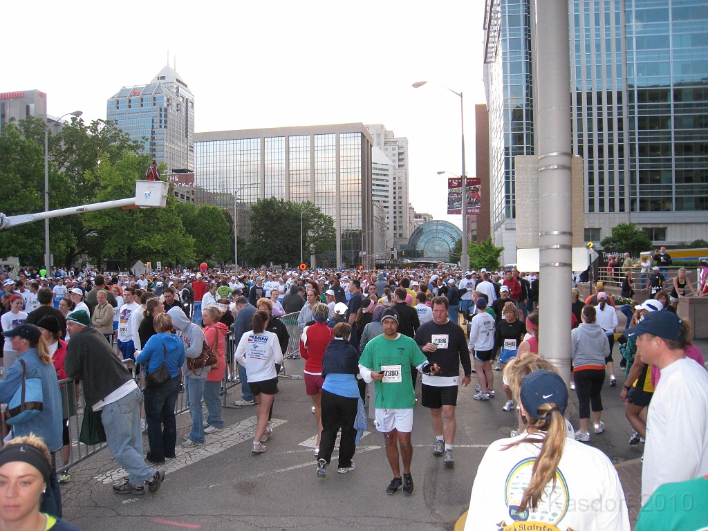 Indy Mini-Marathon 2010 145.jpg - Race day! The crowd starts to gather. No picture I take could capture all of the people. I am not nearly at the front of the line yet and the people go clear back to the glass overpass several blocks away.